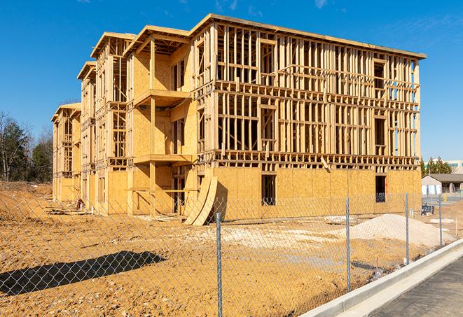 a snapshot of temporary chain link fences protecting a large construction project from unauthorized access in Groves